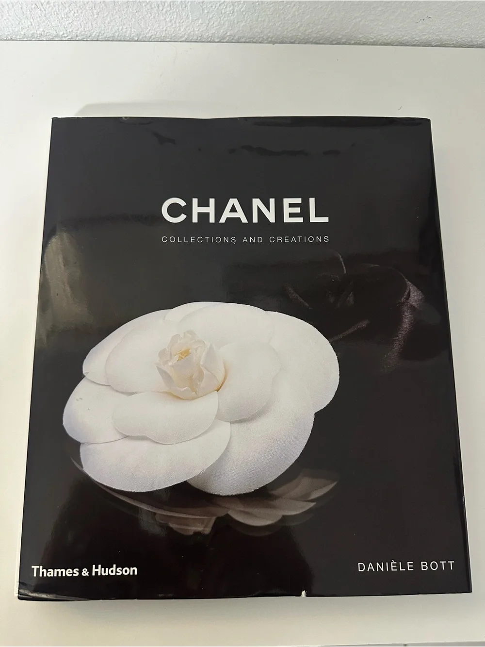 CHANEL Black Cover with White Camellia Motif